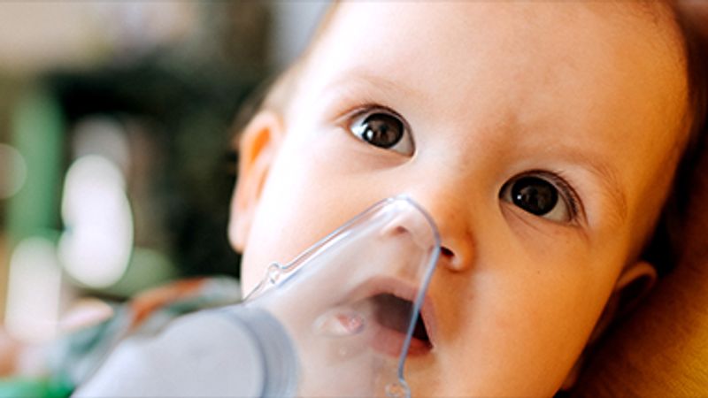 Child with oxygen mask