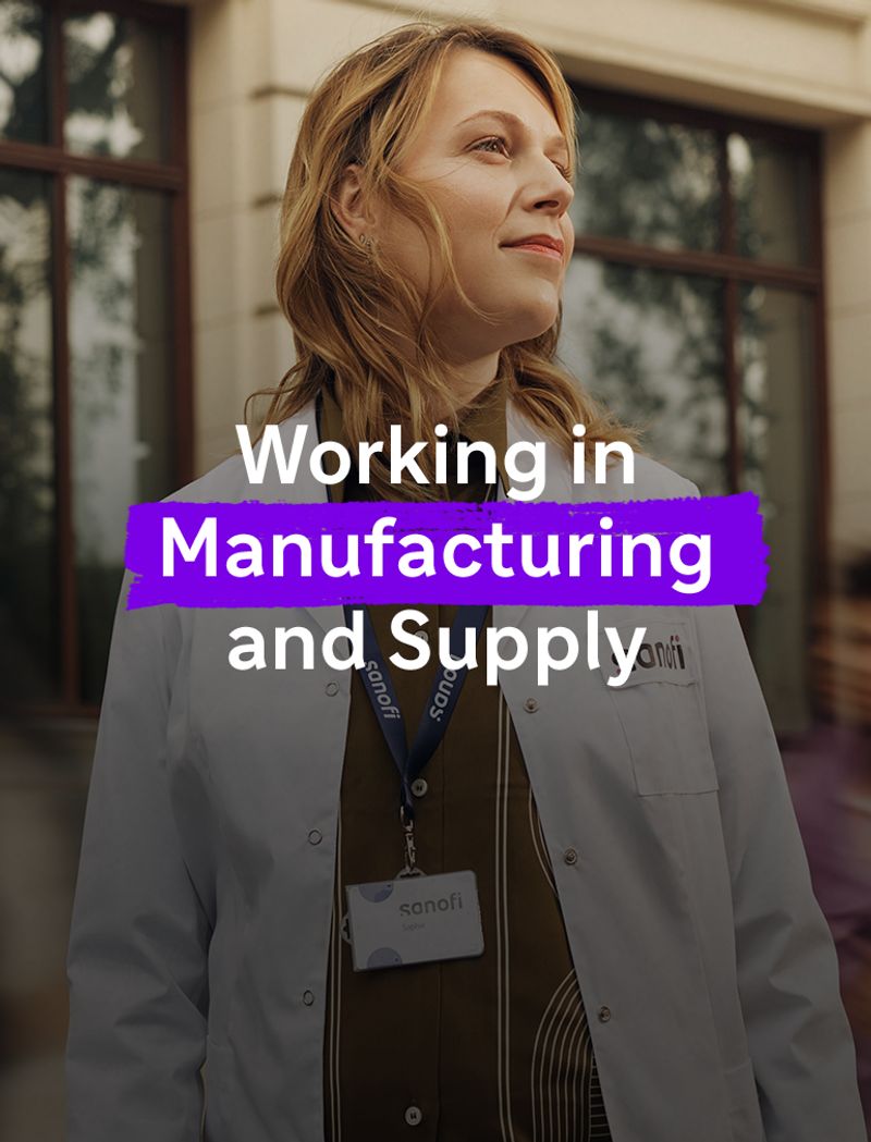 A woman in a white Sanofi lab coat and company badge looks ahead with an optimistic expression while standing outside a building. Overlay text reads: "Working in Manufacturing and Supply."