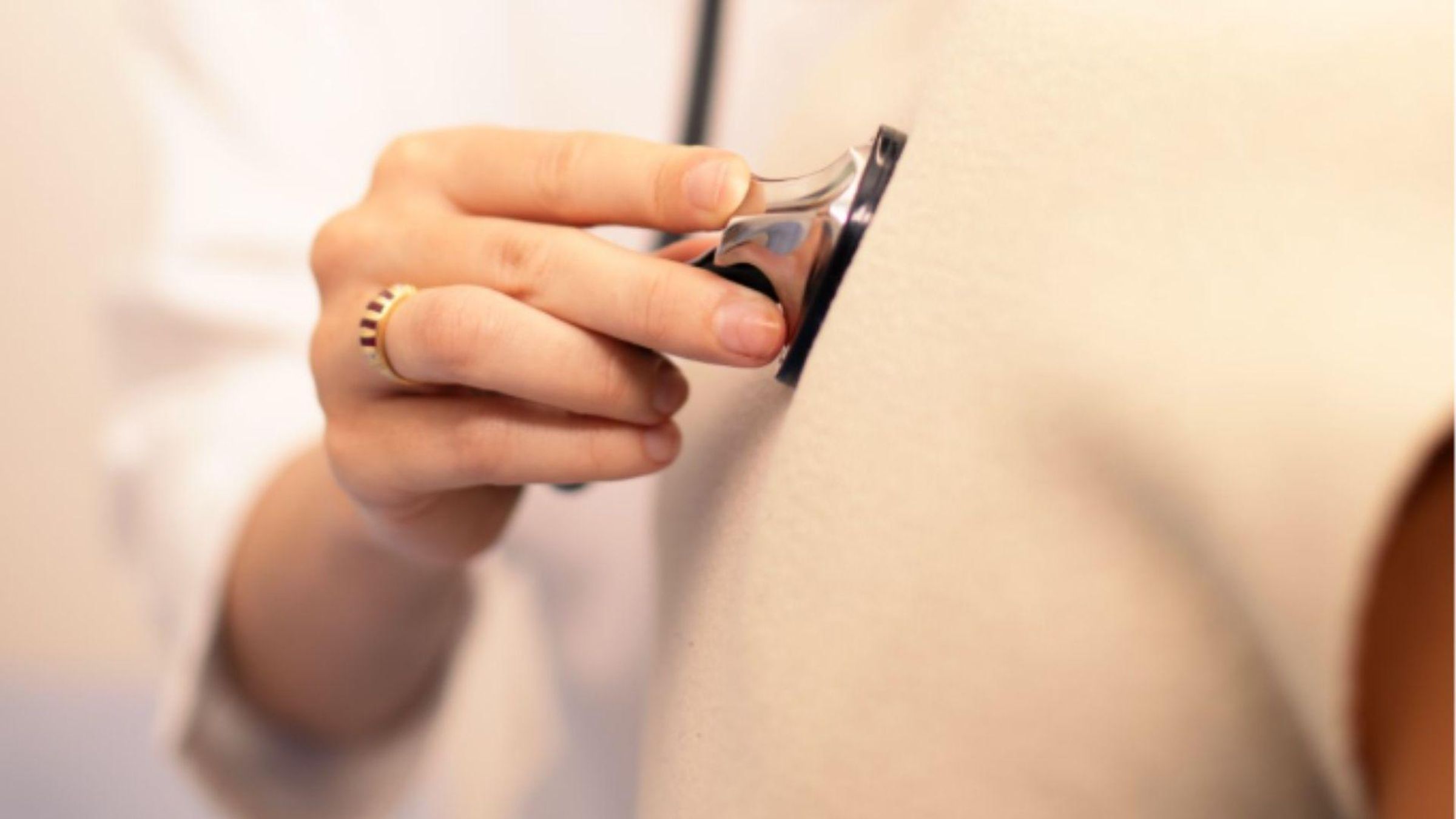 A healthcare provider uses a stethoscope to listen to a patient’s chest.