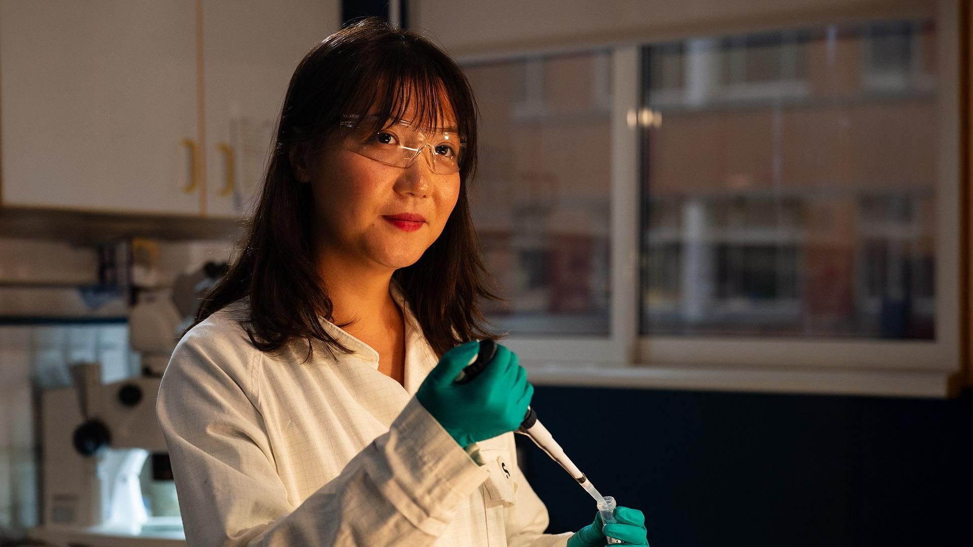 A scientist is seen in a lab with a pipette