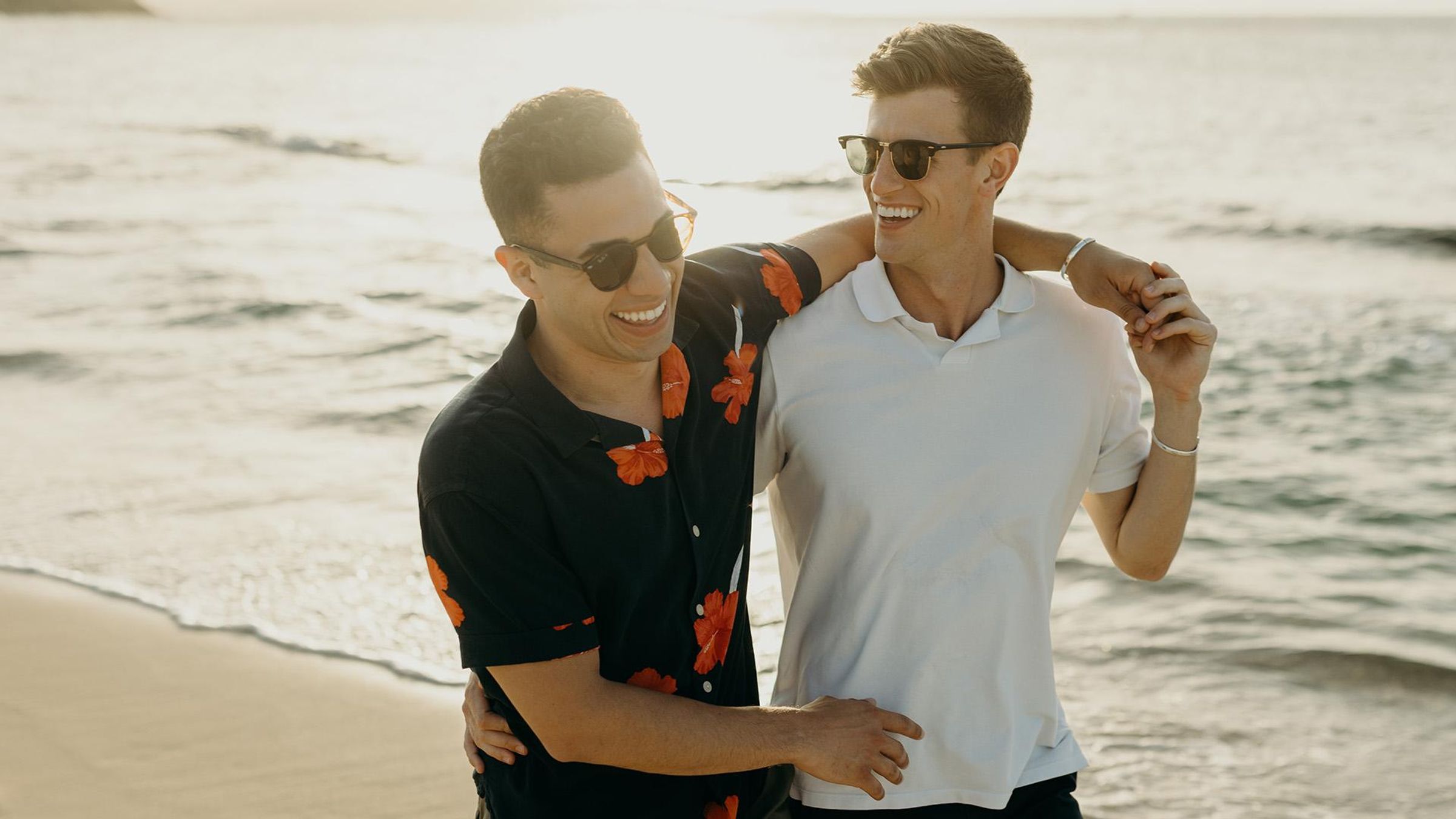 Photography of Jake Prodoehl and his partner on a beach