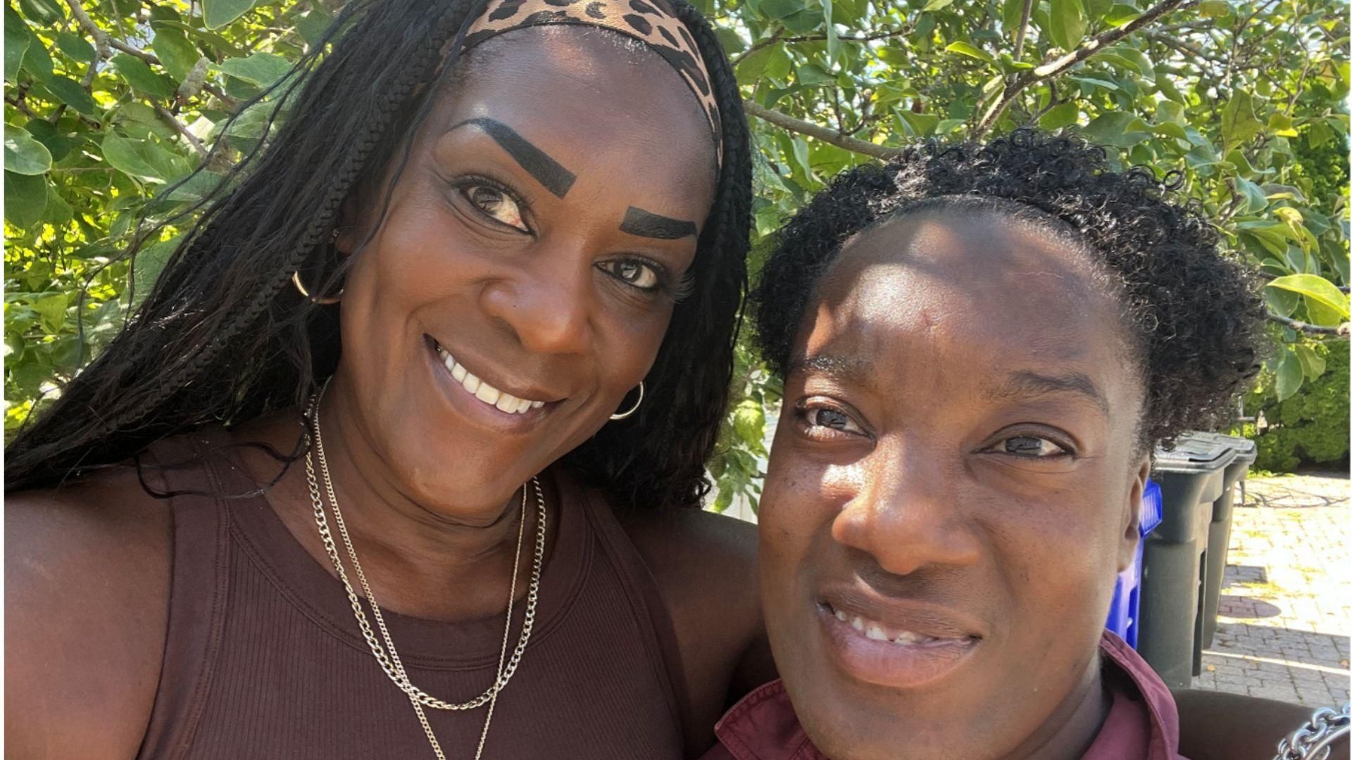 Stacy and her daughter are close together side by side and smiling
