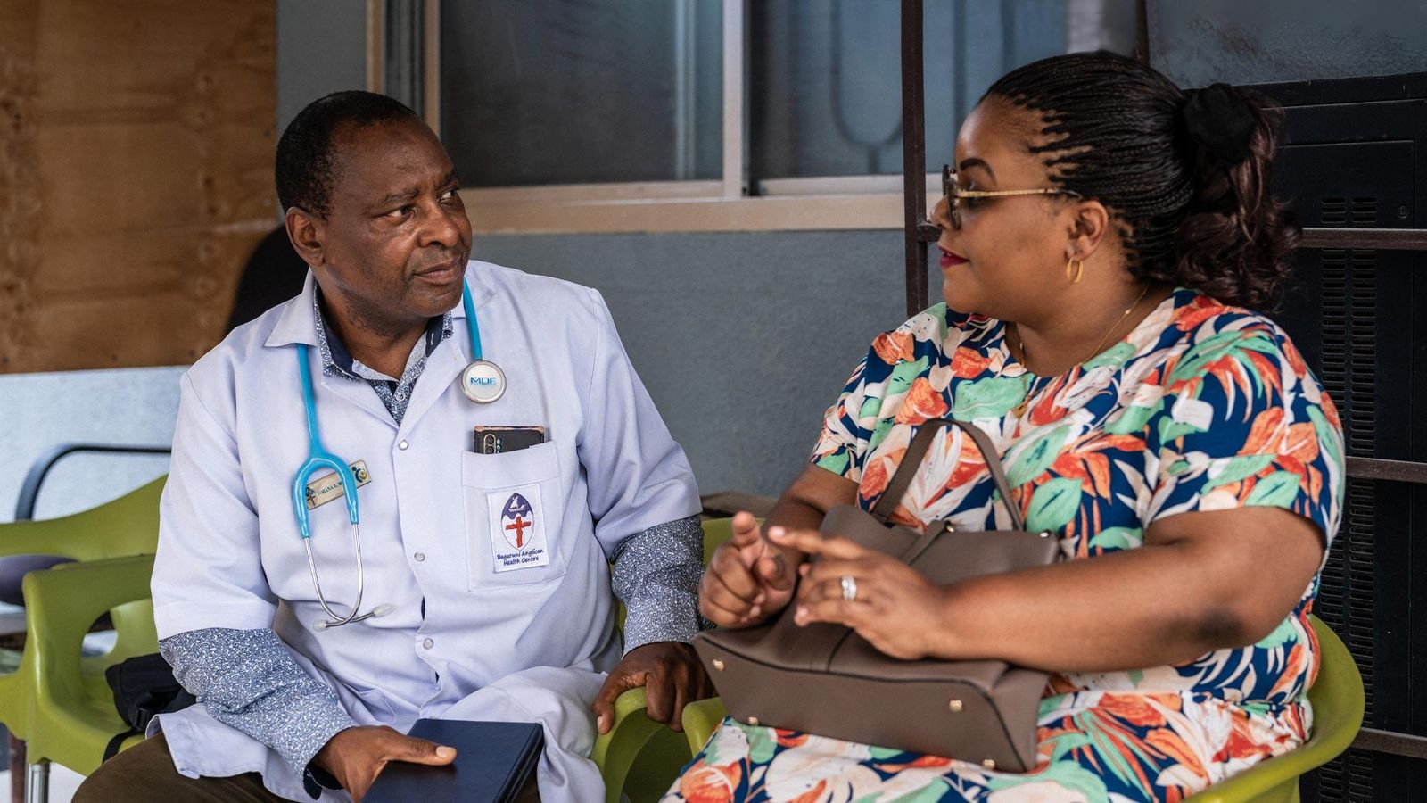 Dr. Yohana Mokiwa chatting with a patient, Dar es Salaam, Tanzania