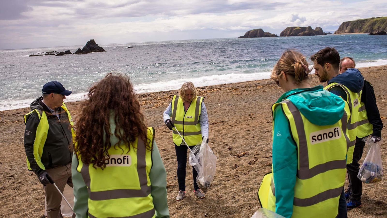 A clean-up operation on Garrarus beach by Sanofi employees, Waterford - Ireland L- R : James Cullen, Heath & Safety Leader, Jennifer Murphy Health Safety & Environment Specialist, Diane Pitard, project manager Planet Care, Sinead Keane Health Safety & Environment Specialist , Julien Lussagnet Communication MSAT