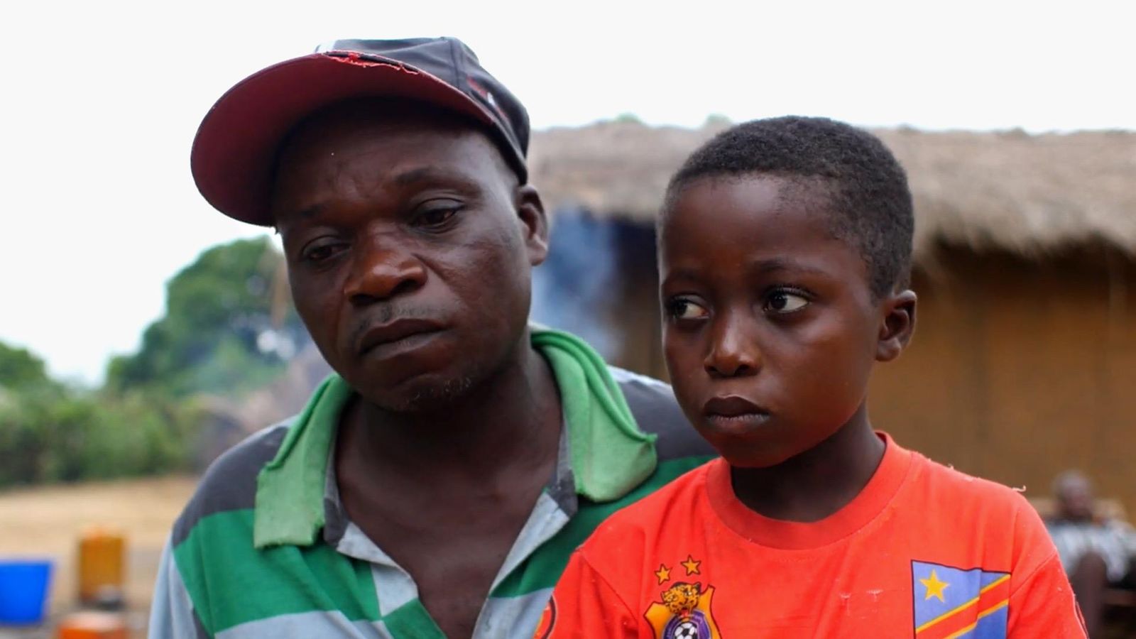 Guy, 12 with his father, is the first child to receive an innovative oral treatment for sleeping sickness, in his hometown Mushie in the Democratic Republic of Congo