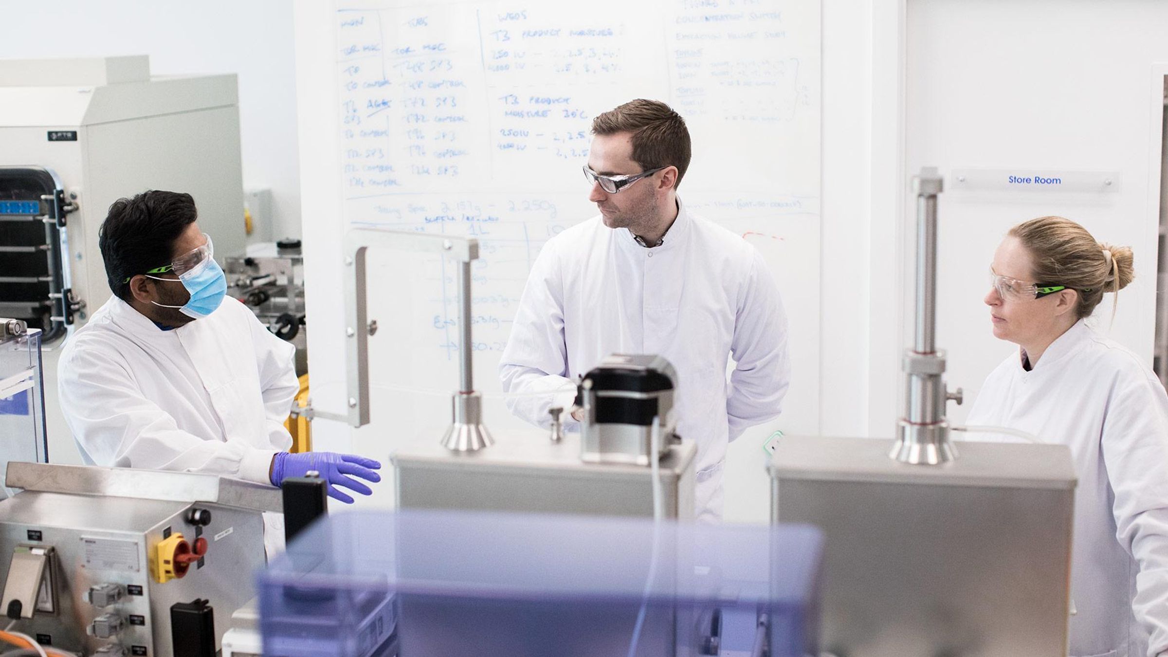 L-R: Chaitanya Sarangapani, Bryan Rellis and Tracey Carroll, scientists discussing the properties of filling syringes 