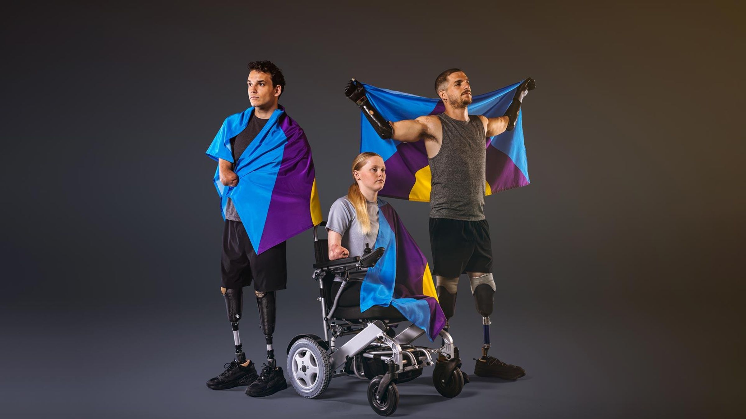 Théo Curin, Ellie Challis and Davide Morana flying the Meningitis Flag