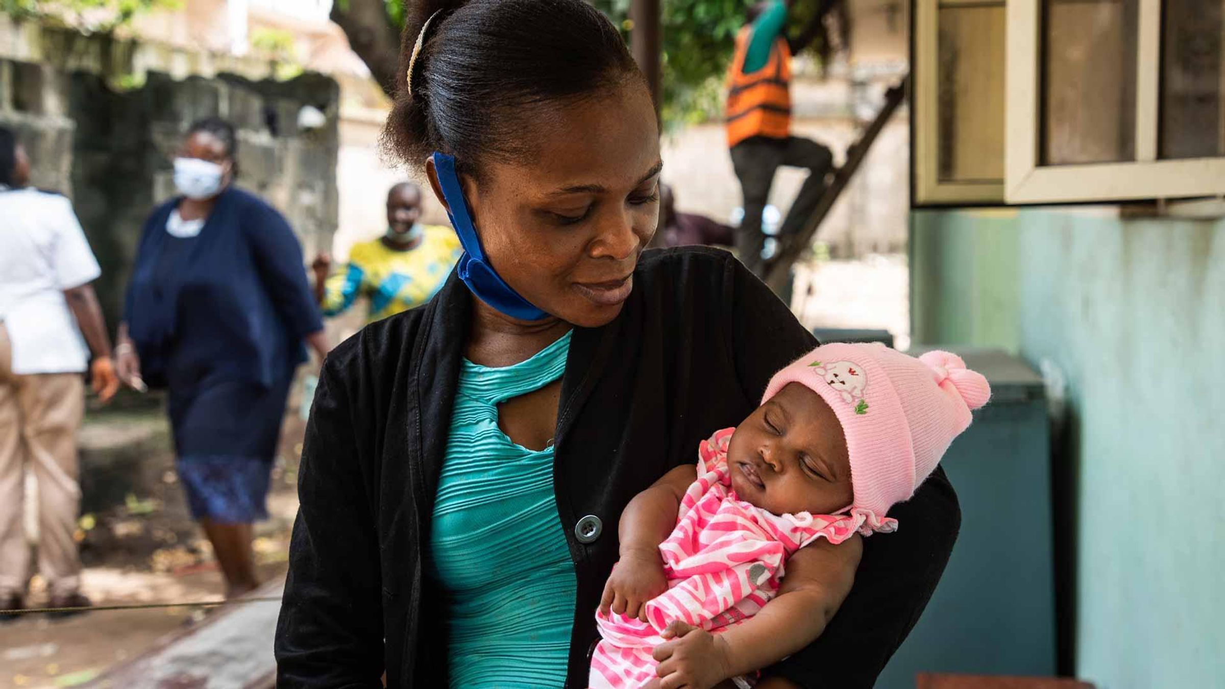 A woman holding her baby in her arms, Nigeria