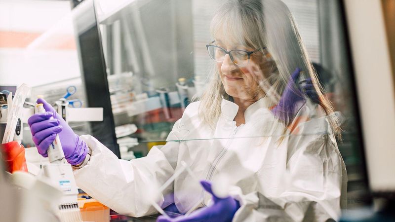 Christine Dureuil Sizaire, Principal Scientist, conducting laboratory research with a pipette at Sanofi